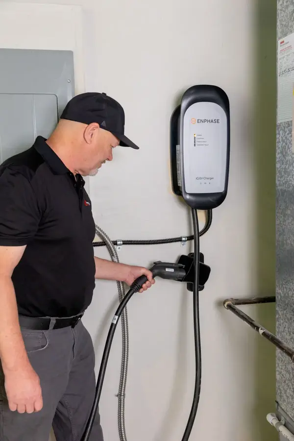 Inspector checking a completed home EV charger installation